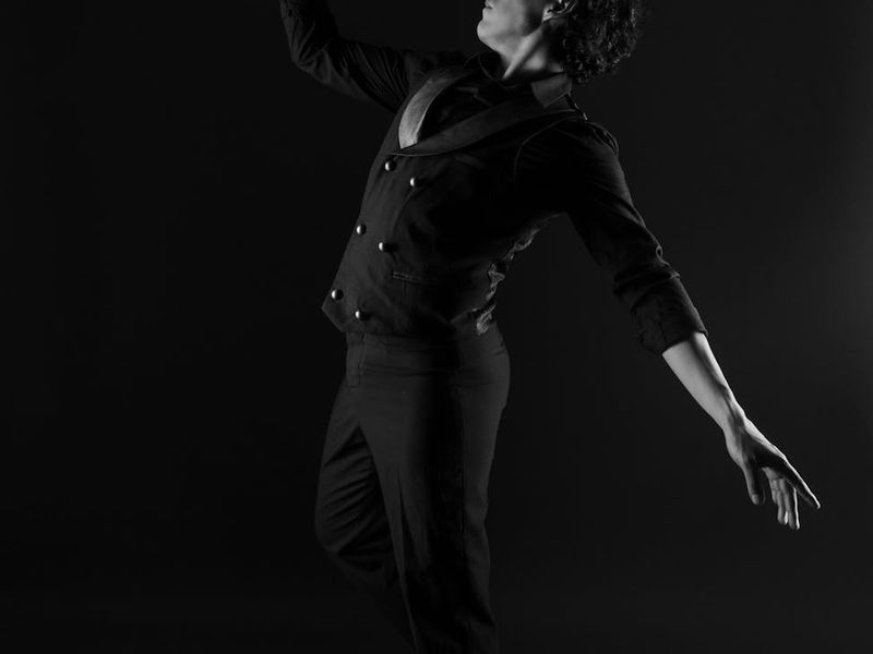 Person in mid-motion during a fluid dance-like exercise.